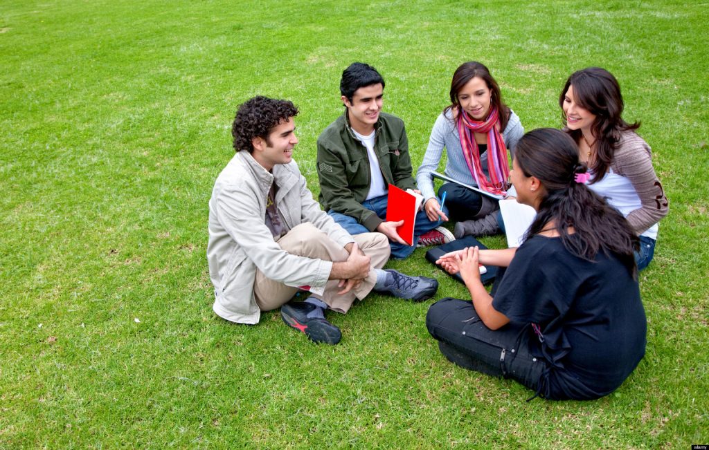 BHA19A Group of students sitting in a circle outdoors